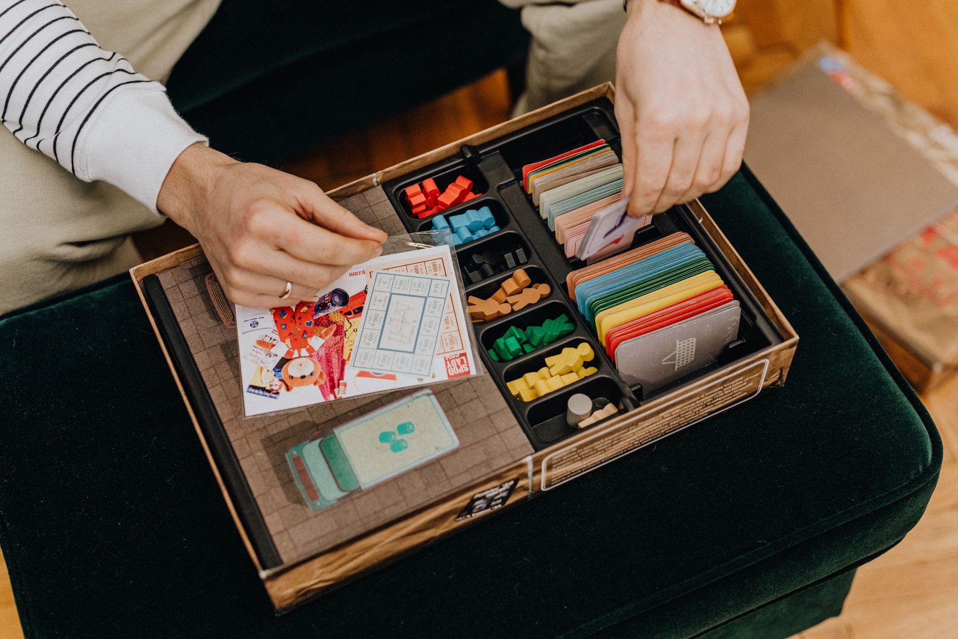 Premium board games and cards setup on a dark wooden table